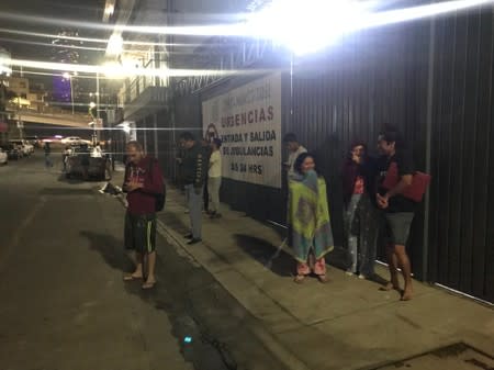 People gather outside after an earthquake was felt in Mexico City, Mexico City