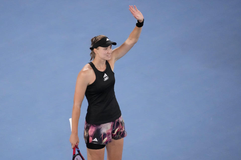 Elena Rybakina of Kazakhstan waves after defeating Victoria Azarenka of Belarus in their semifinal match at the Australian Open tennis championship in Melbourne, Australia, Thursday, Jan. 26, 2023. (AP Photo/Dita Alangkara)