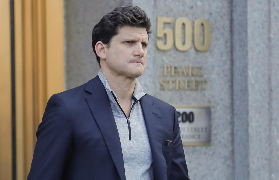 Gordon Caplan of Greenwich, Conn., walks out of federal court, March 12, 2019, in New York. (Photo: Julie Jacobson/AP)