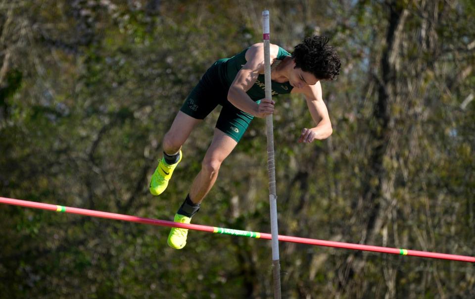 Carson Dean clears the bar for Hendricken in the pole vault during the 2023 season.