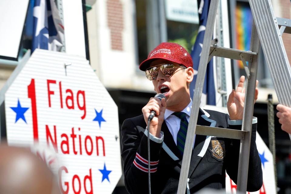 Milo Yiannopoulos leads a "Straight Pride" parade in Boston on Aug. 31, 2019. Supporters of President Donald Trump and counterdemonstrators who called them homophobic extremists staged dueling rallies in Boston.