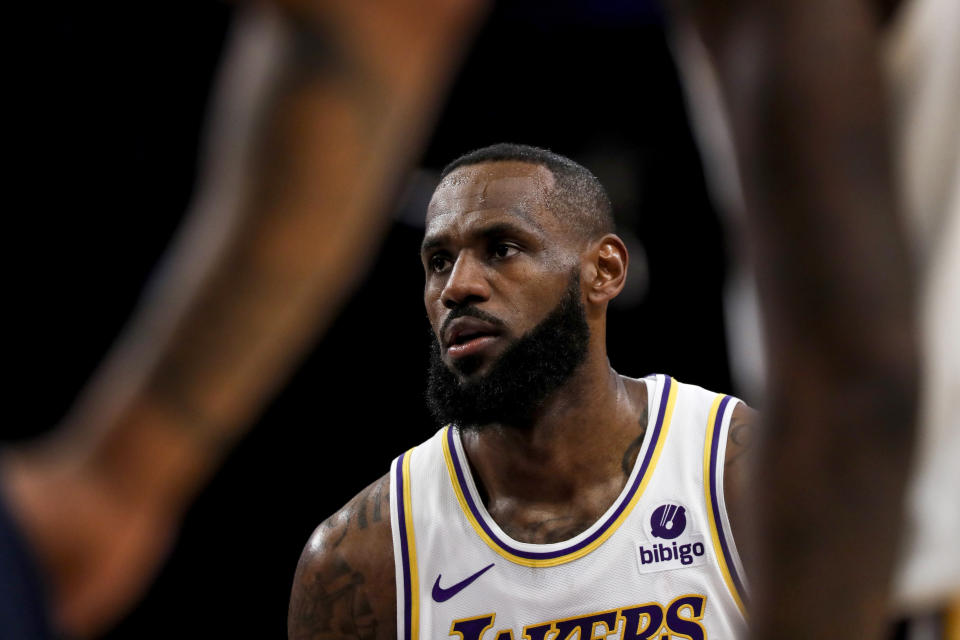 Los Angeles Lakers forward LeBron James (23) concentrates before shooting a free throw during the first half of an NBA basketball game against the Indiana Pacers on Sunday, March 24, 2024, in Los Angeles. (AP Photo/Etienne Laurent)