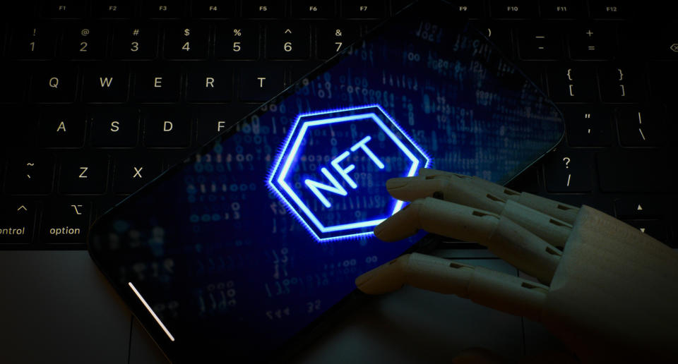 NFT logo is seen on the screen of a mobile device in this photo illustration taken on 01 November, 2023 in Warsaw, Poland. (Photo by Jaap Arriens/NurPhoto via Getty Images)