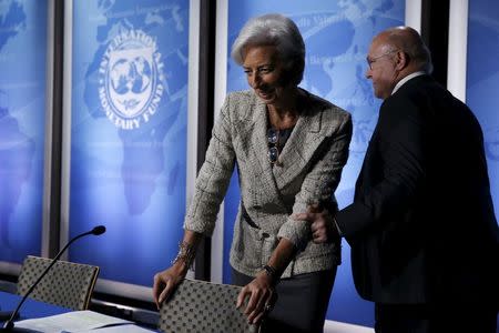 International Monetary Fund (IMF) Managing Director Christine Lagarde (L) and France's Finance Minister Michel Sapin arrive for a news conference at the IMF/World Bank Spring Meetings in Washington April 14, 2016. REUTERS/Jonathan Ernst