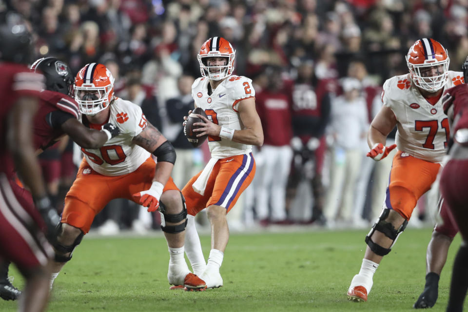 Clemson quarterback Cade Klubnik (2) drops back to pass during the first half of the team's NCAA college football game against South Carolina, Saturday, Nov. 25, 2023, in Columbia, S.C. (AP Photo/Artie Walker Jr.)