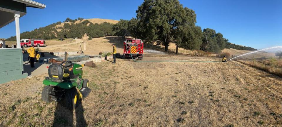 Firefighters respond to a scene of a horse stuck in a pool in rural San Miguel on June 15, 2024. 