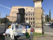 In this photo taken on Tuesday, June 25, 2019, a man walks past a pile of garbage as St. Peter's Dome is visible in background, in Rome. Doctors in Rome are warning of possible health hazards caused by overflowing trash bins in the city streets, as the Italian capital struggles with a renewed garbage emergency aggravated by the summer heat. (AP Photo/Andrew Medichini)