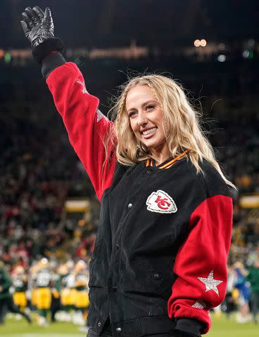 <p>Patrick McDermott/Getty</p> Brittany Mahomes waves before the game between the Kansas City Chiefs and the Green Bay Packers at Lambeau Field on December 03, 2023 in Green Bay, Wisconsin.