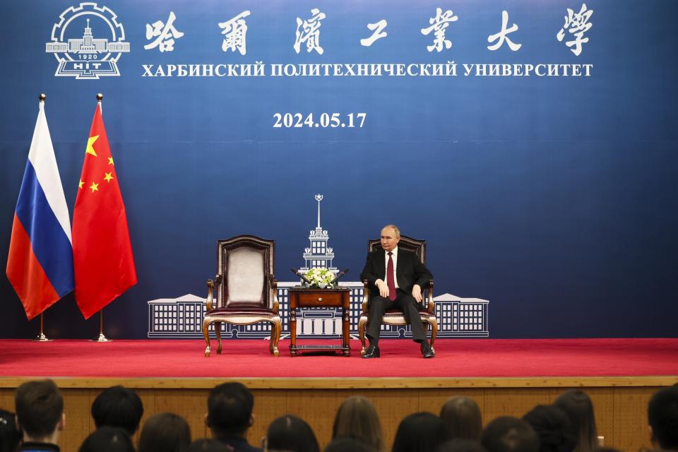 Russian President Vladimir Putin talks with students of the Harbin Institute of Technology in Harbin, northeastern China's Heilongjiang Province, on Friday, May 17, 2024. (Alexander Ryumin, Sputnik, Kremlin Pool Photo via AP)