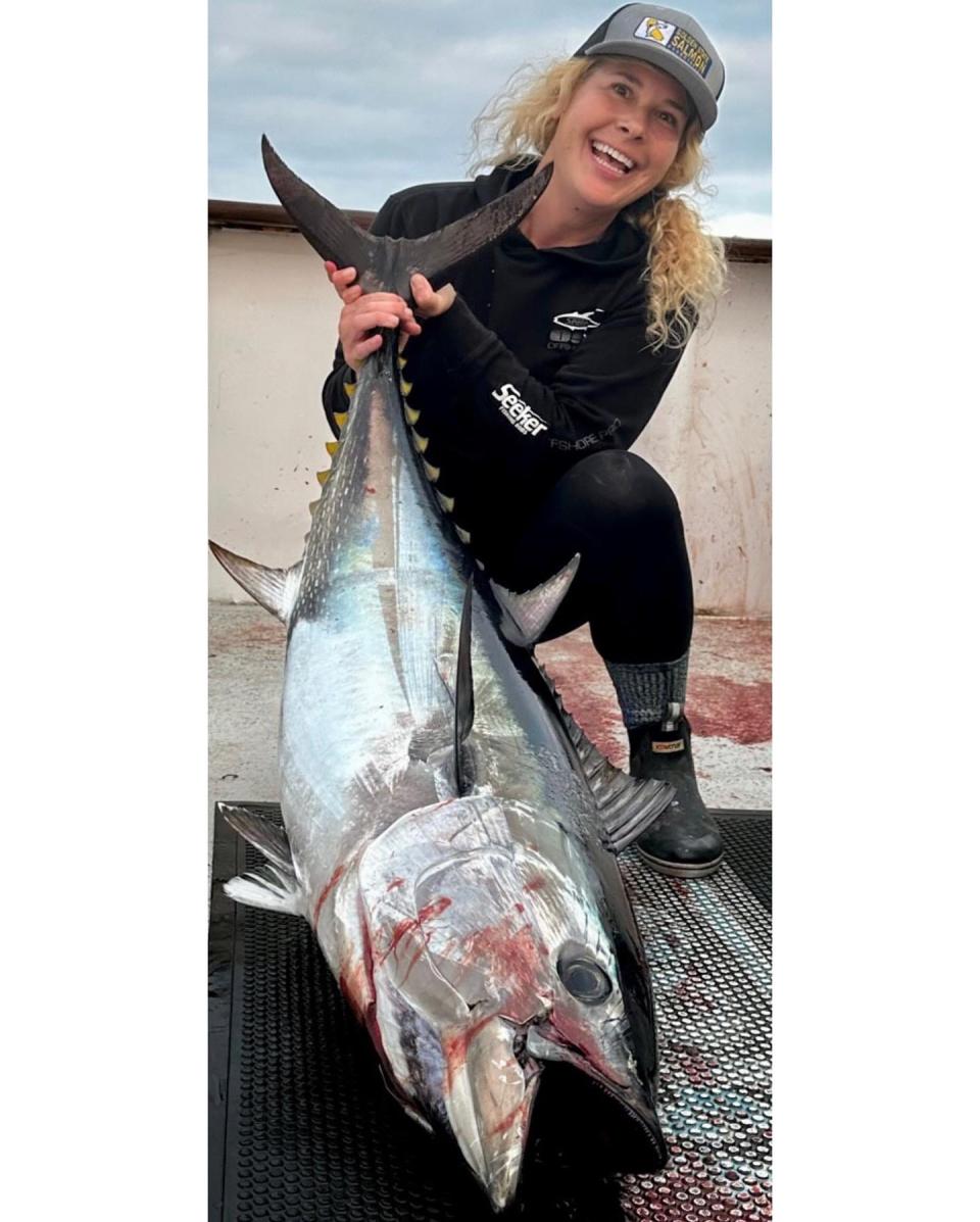 Cat Kaiser, operation and events director for the Golden State Salmon Association (GSSA), shows off one of the bluefin tuna she caught during her September fishing adventure off San Diego aboard the Condor.