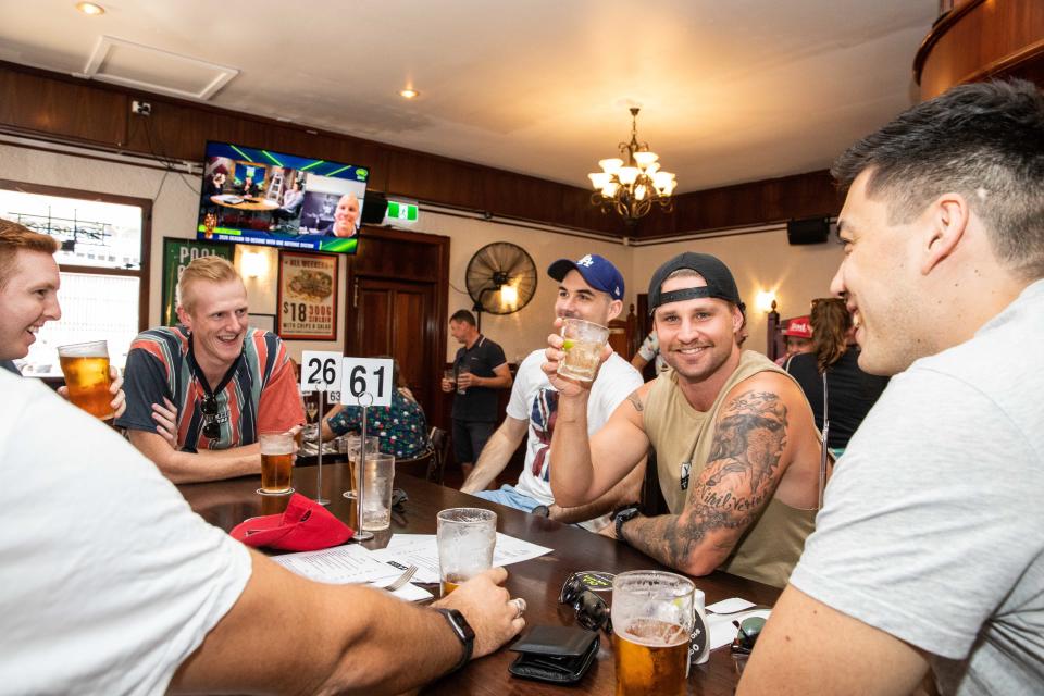 Men shown socialising at the Darwin Hotel in Darwin on Friday. Source: AAP