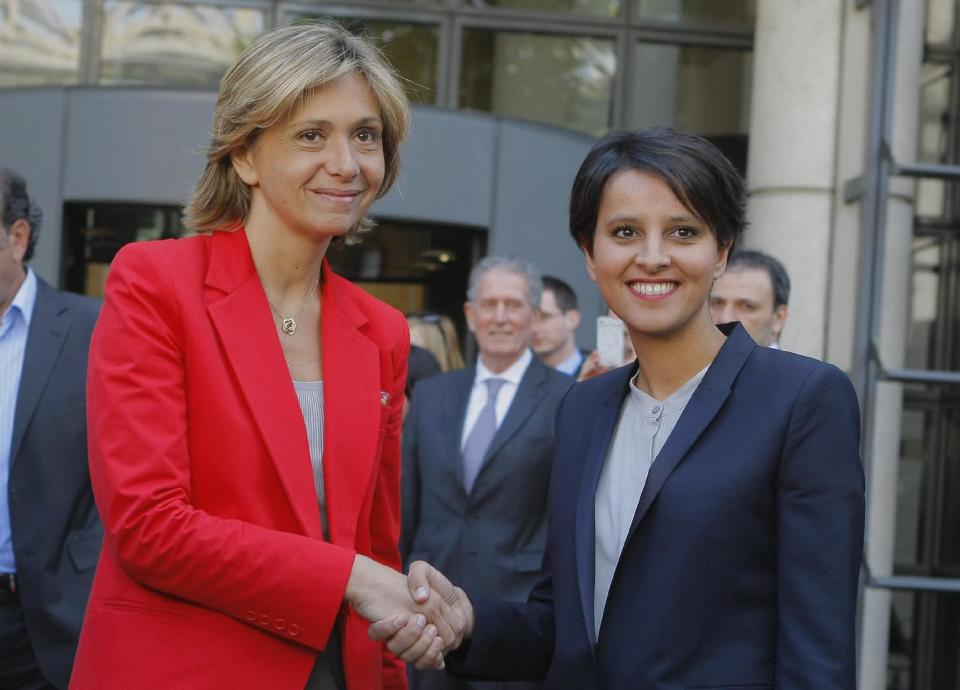 Newly appointed French Women's Rights Minister and government spokesman Najat Vallaud-Belkacem, right, shakes hands with outgoing Budget minister and spokeswoman Valerie Pecresse, at their handover ceremony Thursday May 17, 2012 at the Bercy ministry in Paris.(AP Photo/Jacques Brinon)