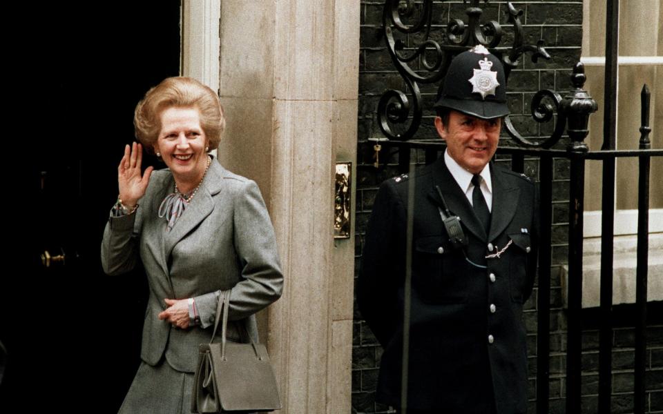 Thatcher with of her favourite frame top handle bags in 1987 - AP