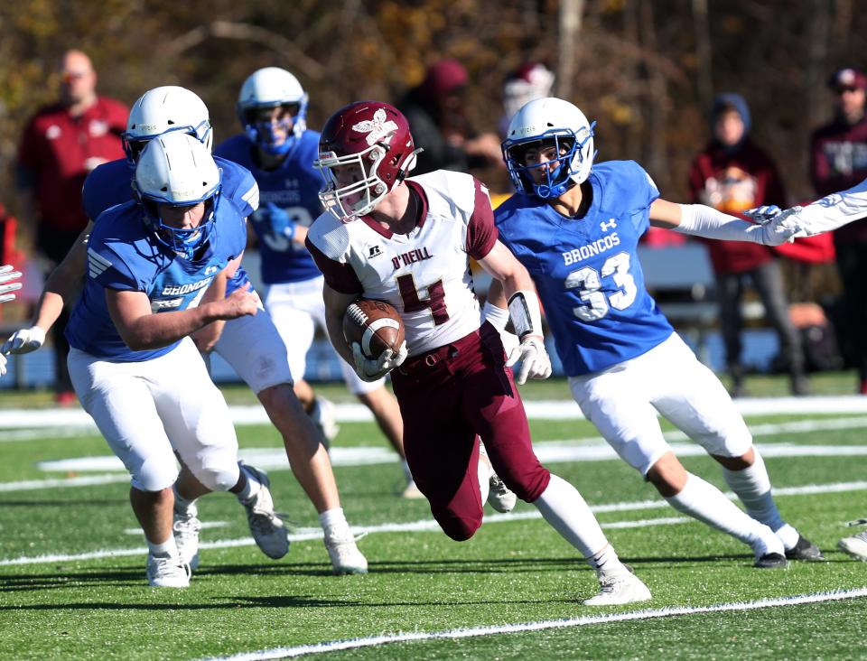 OÕNeilÕs Marek Arbogast (4) looks for some running room in the Bronxville defense during the state Class C quarterfinal playoff game at Mahopac High School Nov. 18, 2023.