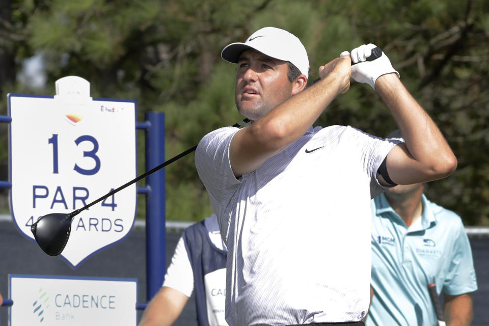 Scottie Scheffler watches his tee shot on the 13th hole during the first round of the Houston Open golf tournament Thursday, Nov. 10, 2022, in Houston. (AP Photo/Michael Wyke)