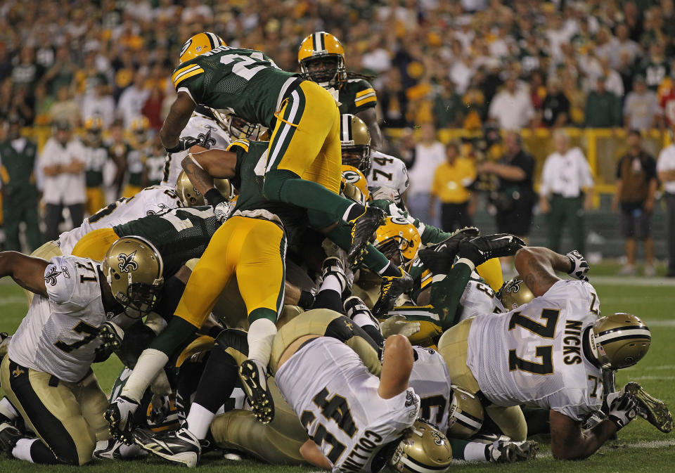 GREEN BAY, WI - SEPTEMBER 08: Members of the Green Bay Packer defense stop the New Orleans Saints short of the goal on the final play of the game during the NFL opening season game at Lambeau Field on September 8, 2011 in Green Bay, Wisconsin. The Packers defeated the Saints 42-34. (Photo by Jonathan Daniel/Getty Images)