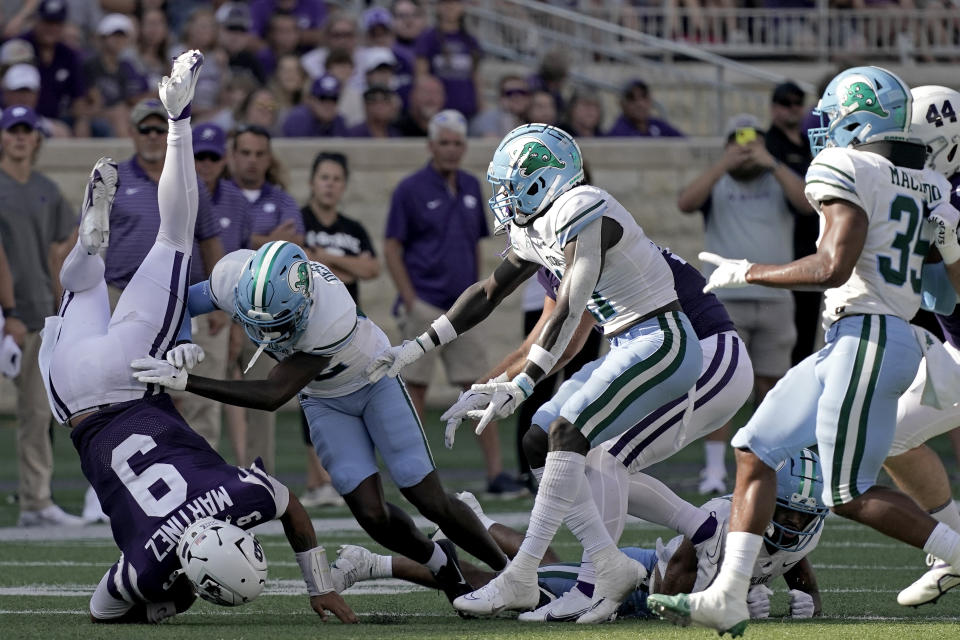 Kansas State quarterback Adrian Martinez (9) is tackled by Tulane cornerback Bailey Despanie (32) during the second half of an NCAA college football game Saturday, Sept. 17, 2022, in Manhattan, Kan. Tulane won 17-10. (AP Photo/Charlie Riedel)