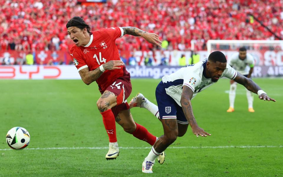 Ivan Toney of England competes with Steven Zuber of Switzerland