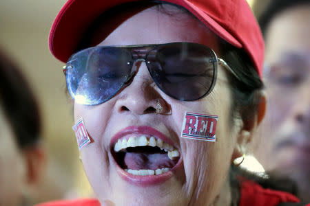 A supporter of Pheu Thai Party reacts after unofficial results, during the general election in Bangkok, Thailand, March 24, 2019. REUTERS/Athit Perawongmetha