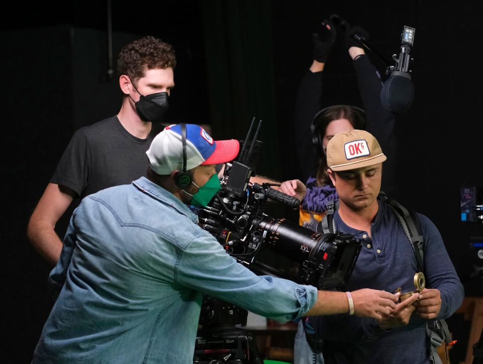 Director Kyle William Roberts, left, gives direction to actor Gattlin Griffith, right, while cinematographer Andrew Smith looks on during the final day of filming on Robert's Oklahoma film "What Rhymes with Reason," a movie on a mission to address teen depression, Monday, October 7, 2022, at Green Pastures Studio in Spencer.