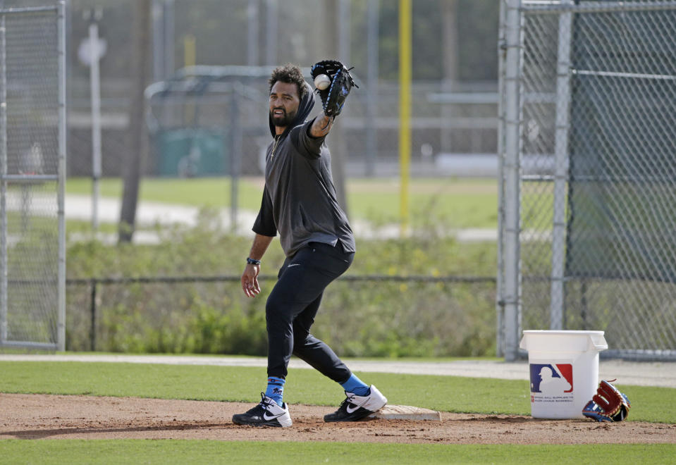 Miami Marlins outfielder Matt Kemp run drills during the spring training baseball workouts for pitchers and catchers at Roger Dean Stadium on Wednesday, Feb. 12, 2020 in Jupiter, Fla. (David Santiago/Miami Herald via AP)