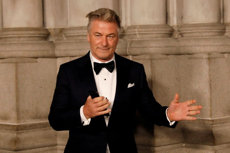 FILE PHOTO: Actor Alec Baldwin gestures before walking on the red carpet during the commemoration of the Elton John AIDS Foundation 25th year fall gala at the Cathedral of St. John the Divine in New York City