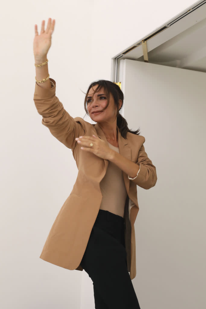 Victoria Beckham looked visibly moved as she waved to the crowd after the SS19 finale [Photo: Getty]