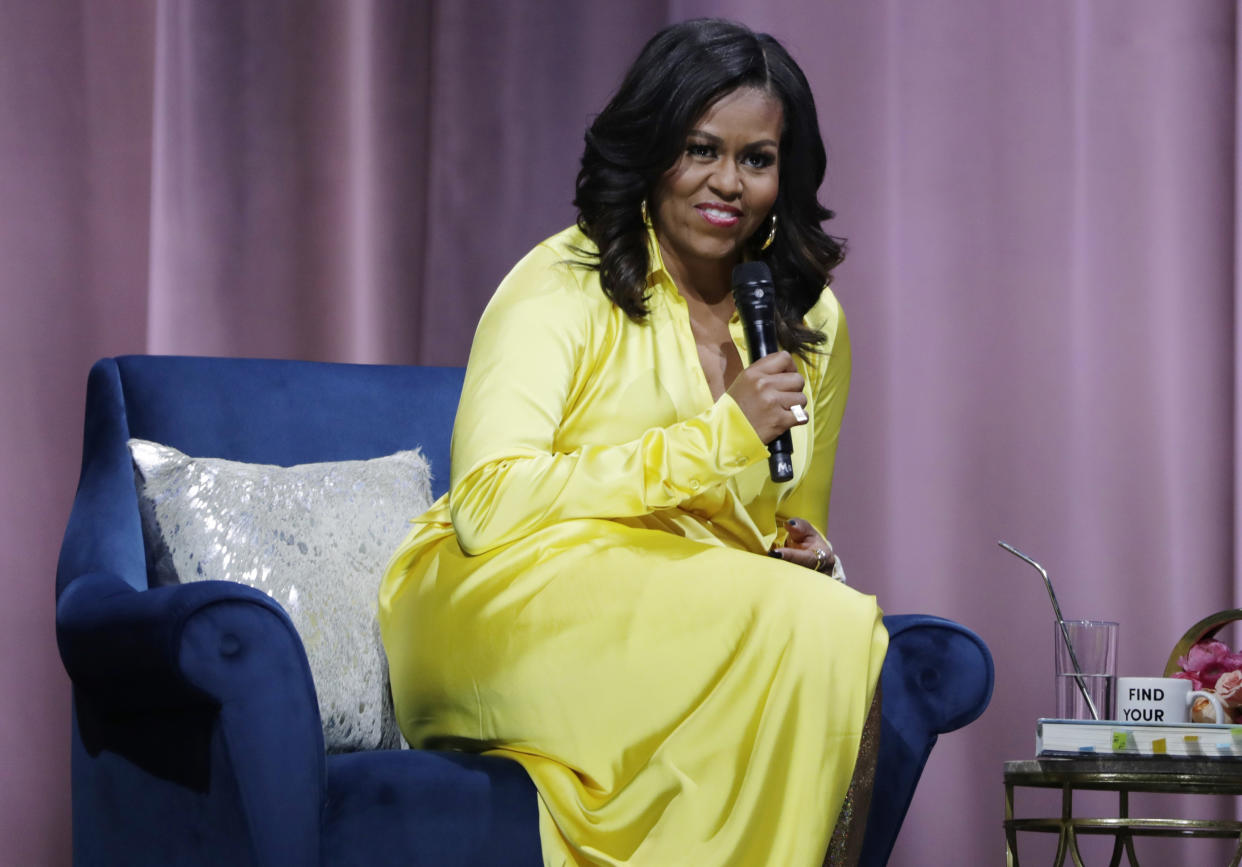 FILE – In this Dec. 19, 2018 file photo, former first lady Michelle Obama responds to questions as she is interviewed by actress Sarah Jessica Parker during an appearance for her book, “Becoming: An Intimate Conversation with Michelle Obama” (AP Photo/Frank Franklin II, File)