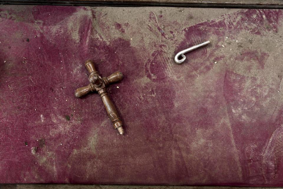 FILE - A damaged bench inside the St. Mark Cathedral in central Cairo, following a bombing, Sunday, Dec. 11, 2016. The blast at Egypt's main Coptic Christian cathedral killed dozens of people and wounded many others on Sunday, according to Egyptian state television, making it one of the deadliest attacks carried out against the religious minority in recent memory. (AP Photo/Nariman El-Mofty, File)