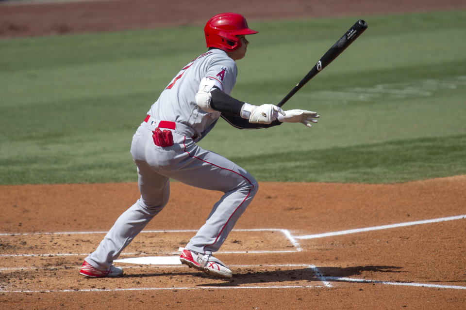 Los Angeles Angels' Shohei Ohtani tracks his infield hit during the first inning of a baseball game against the Los Angeles Dodgers in Los Angeles, Sunday, Sept. 27, 2020. (AP Photo/Kyusung Gong)