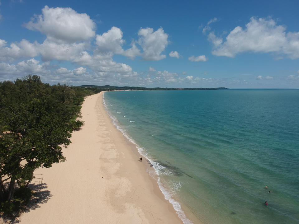 Aerial shot of the sandy Desaru beach in Malaysia alongside the calm blue sea on a sunny day. (Photo: Gettyimages)