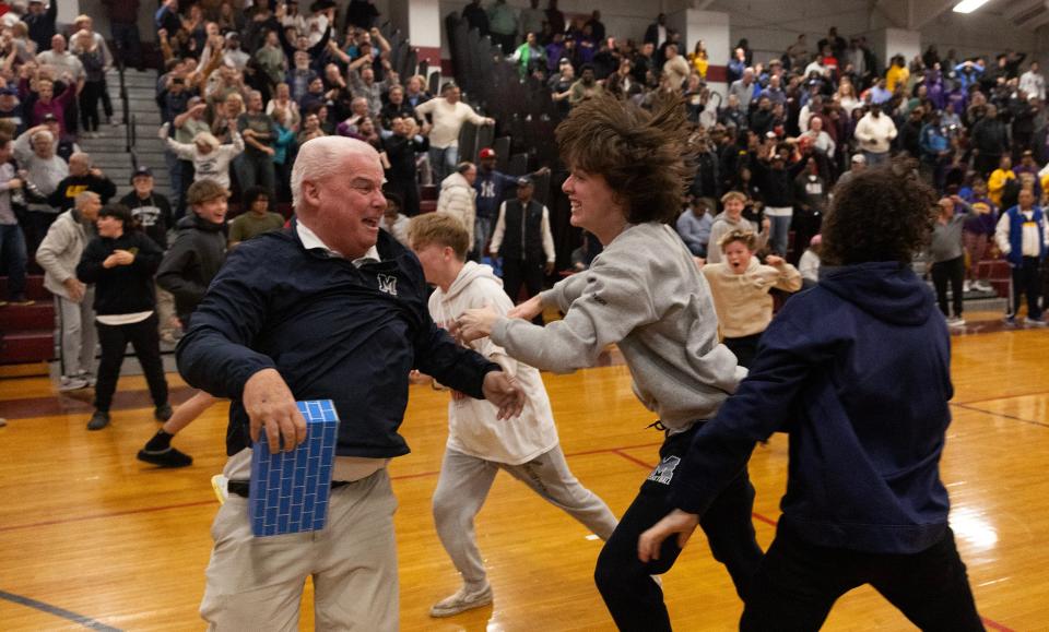 Mansquan celebrates when they think they won but the basket was called off. Manasquan Boys Basketball lose to Camden in NJSIAA Group 2 Semifinals in Berkeley Township, NJ on March 5, 2024.