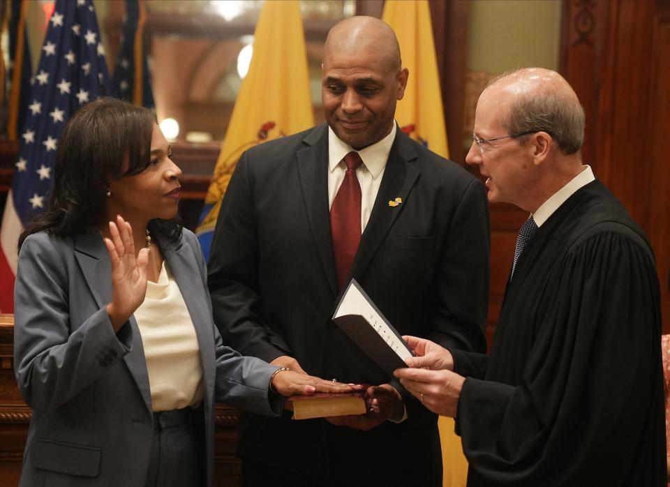Trenton, NJ September 8, 2023 -- Tahesha Way, with her husband Charles holding the Bible is sworn in as the new Lt. Governor by NJ Chief Justice Stuart Rabner.
 Tahesha Way was sworn in as the new New Jersey Lt. Governor, replacing the late Sheila Oliver. The ceremony took place outside Governor Phil Murphy's office in the NJ Statehouse on September 8, 2023.