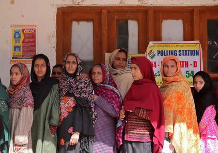 People wait in queues to cast their votes outside a polling station during the second phase of general election in Ganderbal district in Jammu and Kashmir state April 18, 2019. REUTERS/Danish Ismail