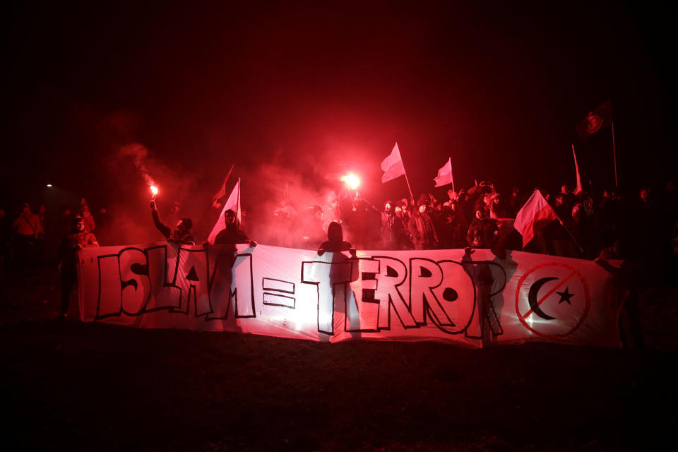 <p>Protesters carry Polish flags and banner during a rally, organised by far-right, nationalist groups, to mark 99th anniversary of Polish independence in Warsaw, Poland, Nov. 11, 2017. (Photo: Agencja Gazeta/Adam Stepien via Reuters) </p>