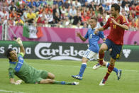 Spanish midfielder Cesc Fabregas (R) scores against Italian goalkeeper Gianluigi Buffon during the Euro 2012 championships football match Spain vs Italy on June 10, 2012 at the Gdansk Arena. AFP PHOTO / PIERRE-PHILIPPE MARCOUPIERRE-PHILIPPE MARCOU/AFP/GettyImages