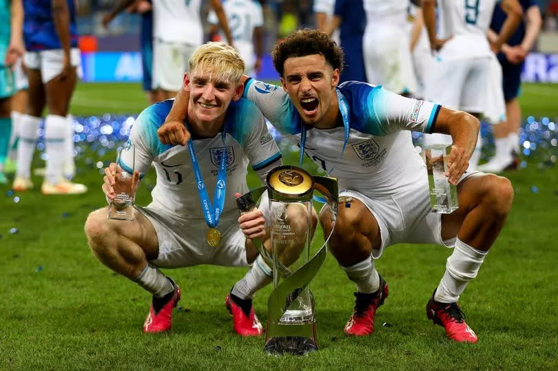 Anthony Gordon of England and Curtis Jones of England celebrate with the trophy after winning the UEFA Under-21 Euro 2023 final match between England and Spain on July 8, 2023 in Batumi, Georgia.