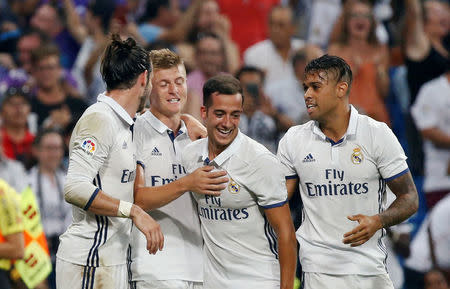 Football Soccer - Spanish Liga Santander - Real Madrid v Celta Vigo- Santiago Bernabeu, Madrid, Spain 27/08/16. Real Madrid's Toni Kroos celebrates his goal with teammates Gareth Bale, Lucas Vazquez and Mariano Diaz. REUTERS/Andrea Comas