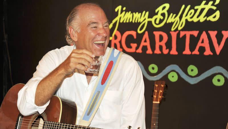 Jimmy Buffett takes a break during a set of music at his Margaritaville Cafe in Key West, Fla in Feb. 12, 2009. Buffett, who popularized beach bum soft rock with the escapist Caribbean-flavored song “Margaritaville” and turned that celebration of loafing into an empire of restaurants, resorts and frozen concoctions, has died, Friday, Sept. 1, 2023. 