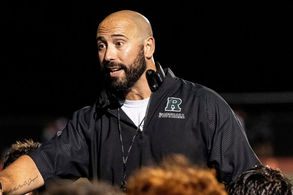 Ramapo High School hosts Wayne Hills during a football game in Franklin Lakes, NJ on Friday September 9, 2022. Ramapo coach Mike DeFazio talks to the team after their 48-7 win.