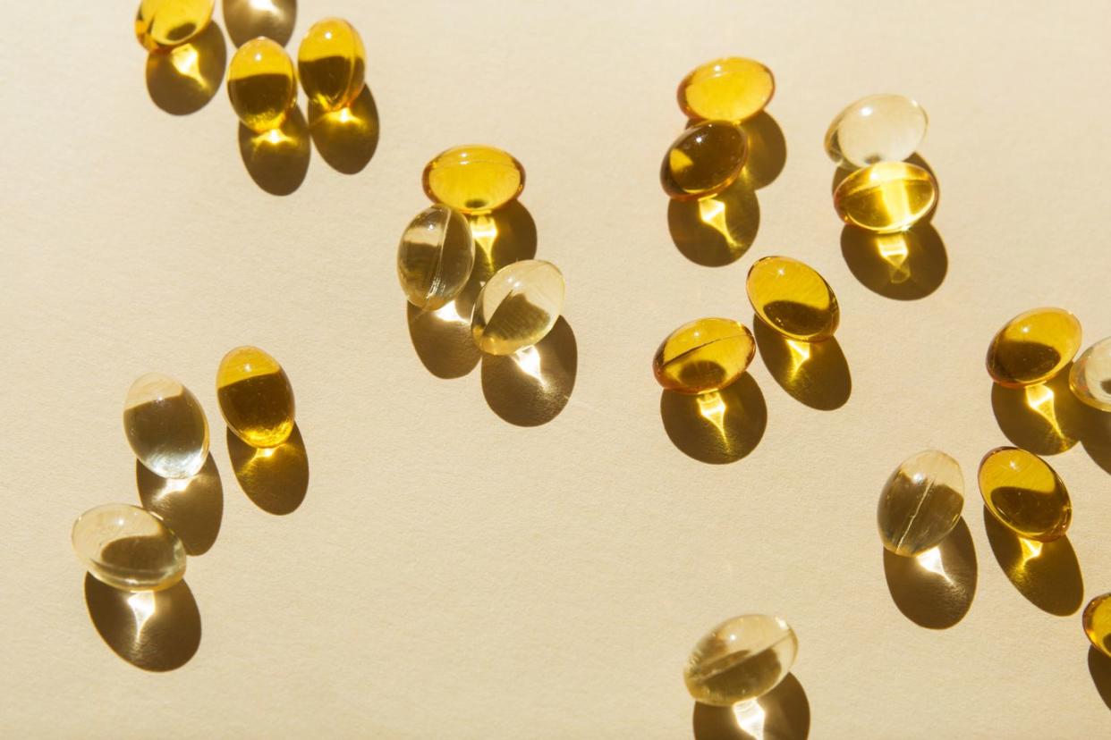 soft vitamin d capsules on a beige background