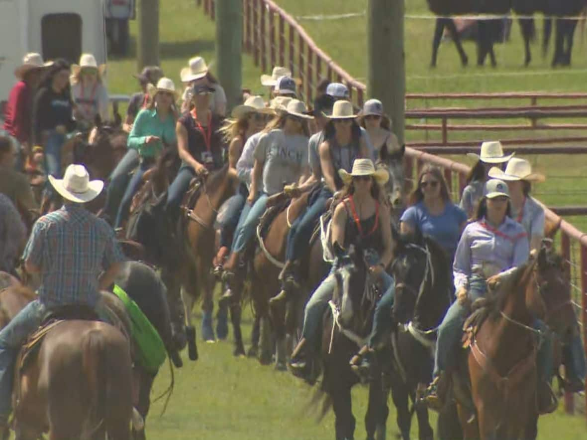 Riders prepare for the opening of the Ponoka Stampede. (Nathan Gross/CBC - image credit)