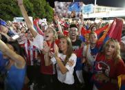 Supporters of Serbia's Novak Djokovic celebrate as they wait for him to appear after he won his final match against Britain's Andy Murray at the Australian Open tennis tournament at Melbourne Park, Australia, January 31, 2016. REUTERS/Issei Kato