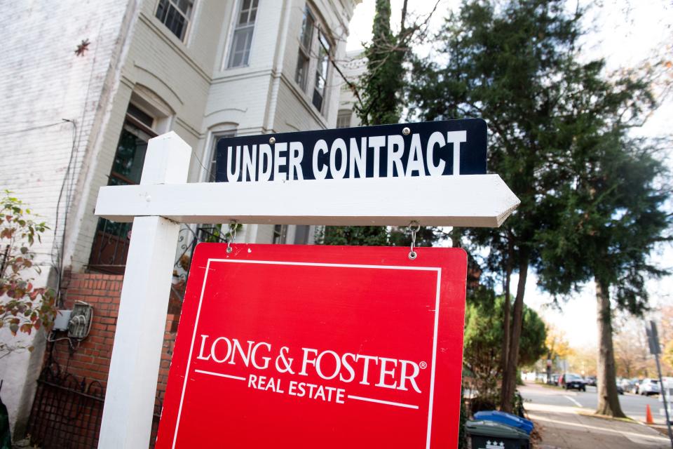 A house's real estate for sale sign shows the home as being "Under Contract" in Washington, DC, November 19, 2020. - The US real estate market is booming even as the coronavirus crisis intensifies, and the seemingly insatiable appetite for new and older homes has sent prices soaring -- meaning more and more families with modest incomes are seeing their dreams of owning property shattered. (Photo by SAUL LOEB / AFP) (Photo by SAUL LOEB/AFP via Getty Images)