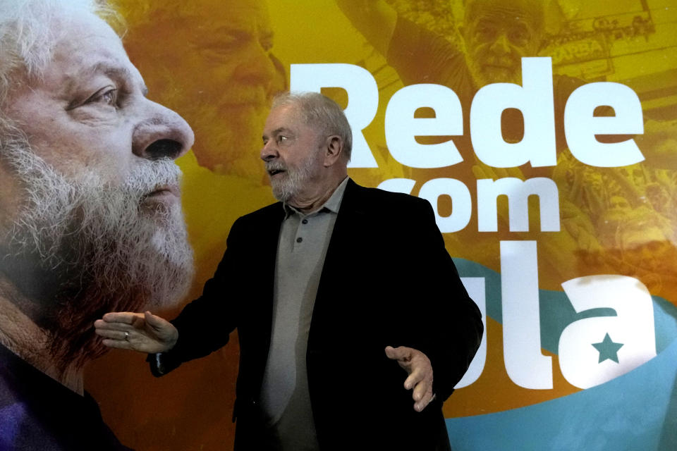 Brazil's Former President Luiz Inacio Lula da Silva, who is running for reelection, arrives for a meeting with leaders of the Rede Sustainability Party in Brasilia, Brazil, Thursday, April 28, 2022. The conference brings together leftist political parties to discuss strategies and policy platforms in anticipation of Oct. elections. (AP Photo/Eraldo Peres)