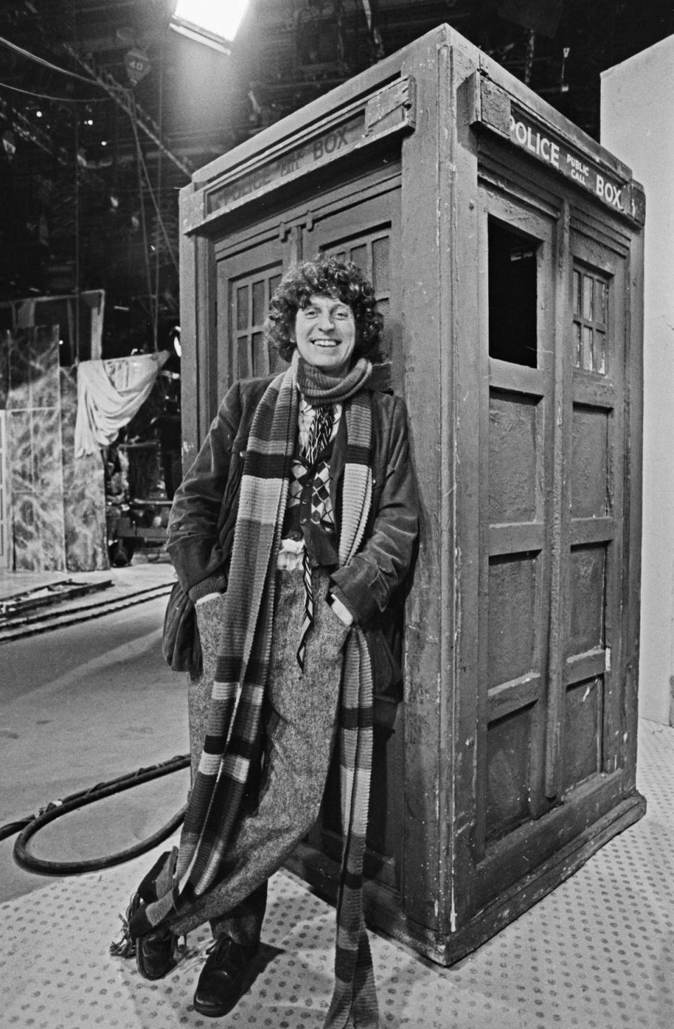 Baker pictured standing in front of the Tardis. He took over as the fourth Doctor in the BBC series in December 1974 (Getty Images)