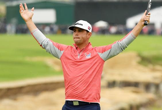 Woodland celebrates his winning putt (Getty Images)