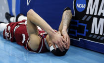 <p>New Mexico State guard Trevelin Queen falls to the court after missing the final shot in the second half during a first round men’s college basketball game against Auburn in the NCAA Tournament, Thursday, March 21, 2019, in Salt Lake City. (Rick Bowmer/AP) </p>