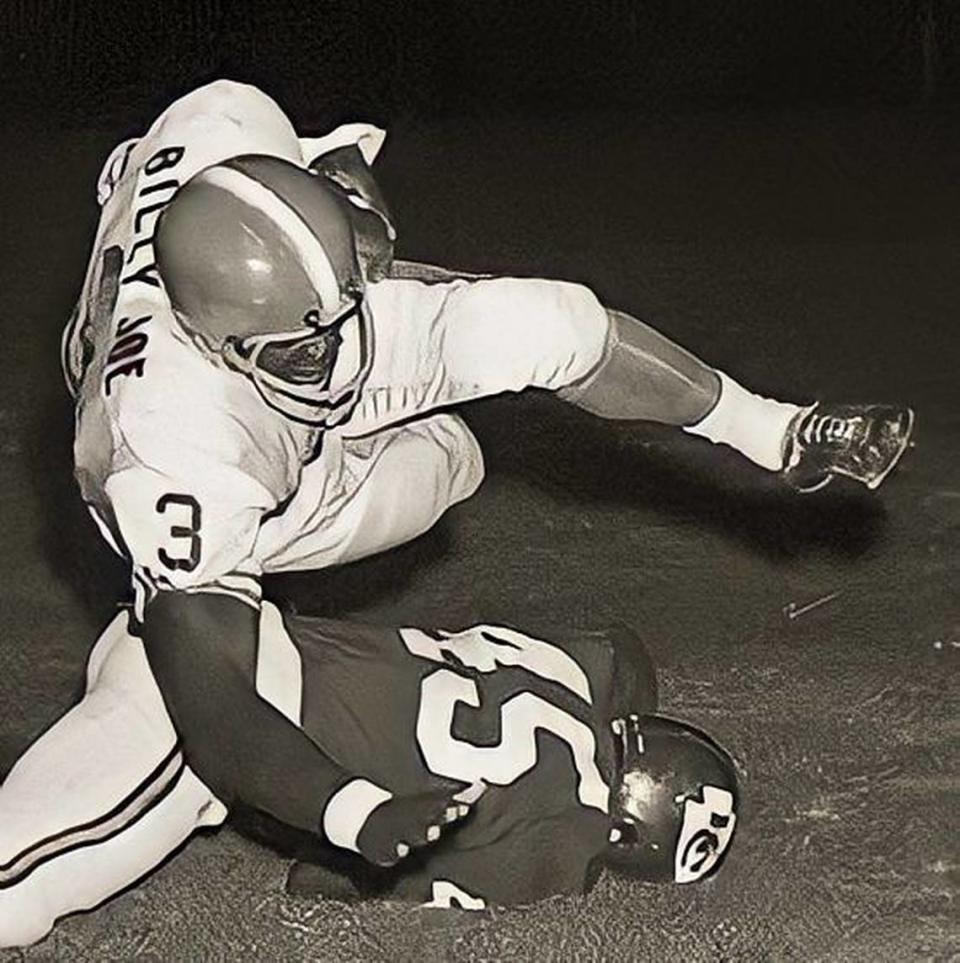 Denver Broncos running back Billy Joe goes sailing after a hit by the Kansas City Chiefs’ Dave Grayson for a gain of 7 yards in the Chiefs’ 14-10 exhibition victory over the Broncos Aug. 28, 1964, at Farrington Field in Fort Worth.