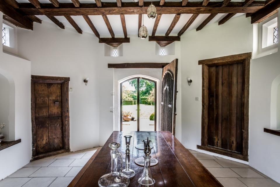 The dining room with the original studded oak front door (Hamptons)